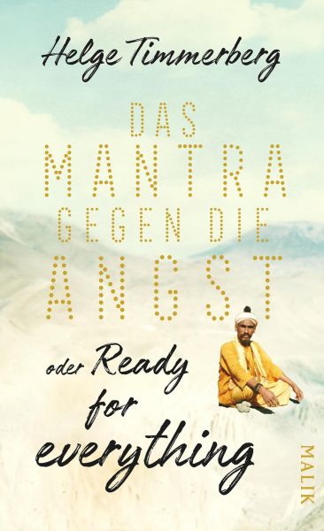 Cover Helge Timmerberg: Das Mantra gegen die Angst. Abgebildet ist eine Berglandschaft, im Vordergrund sitzt ein Mann in einem mönchsartigen Gewand im Schneidersitz auf dem Boden.